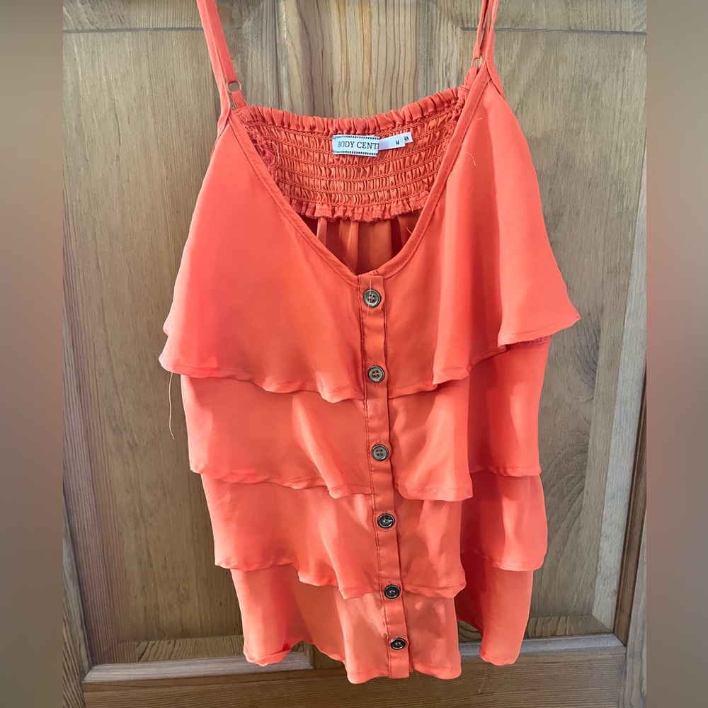 Neon orange frilly tank